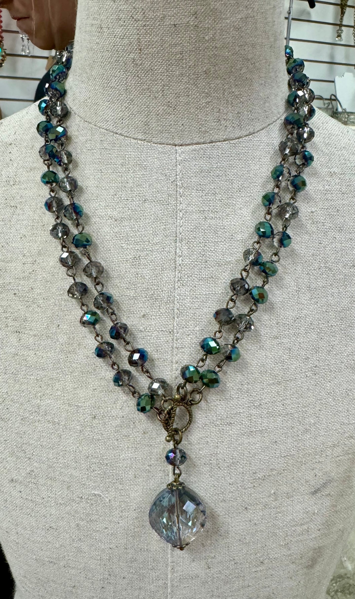 Blue green crystal chain front toggle necklace with drop